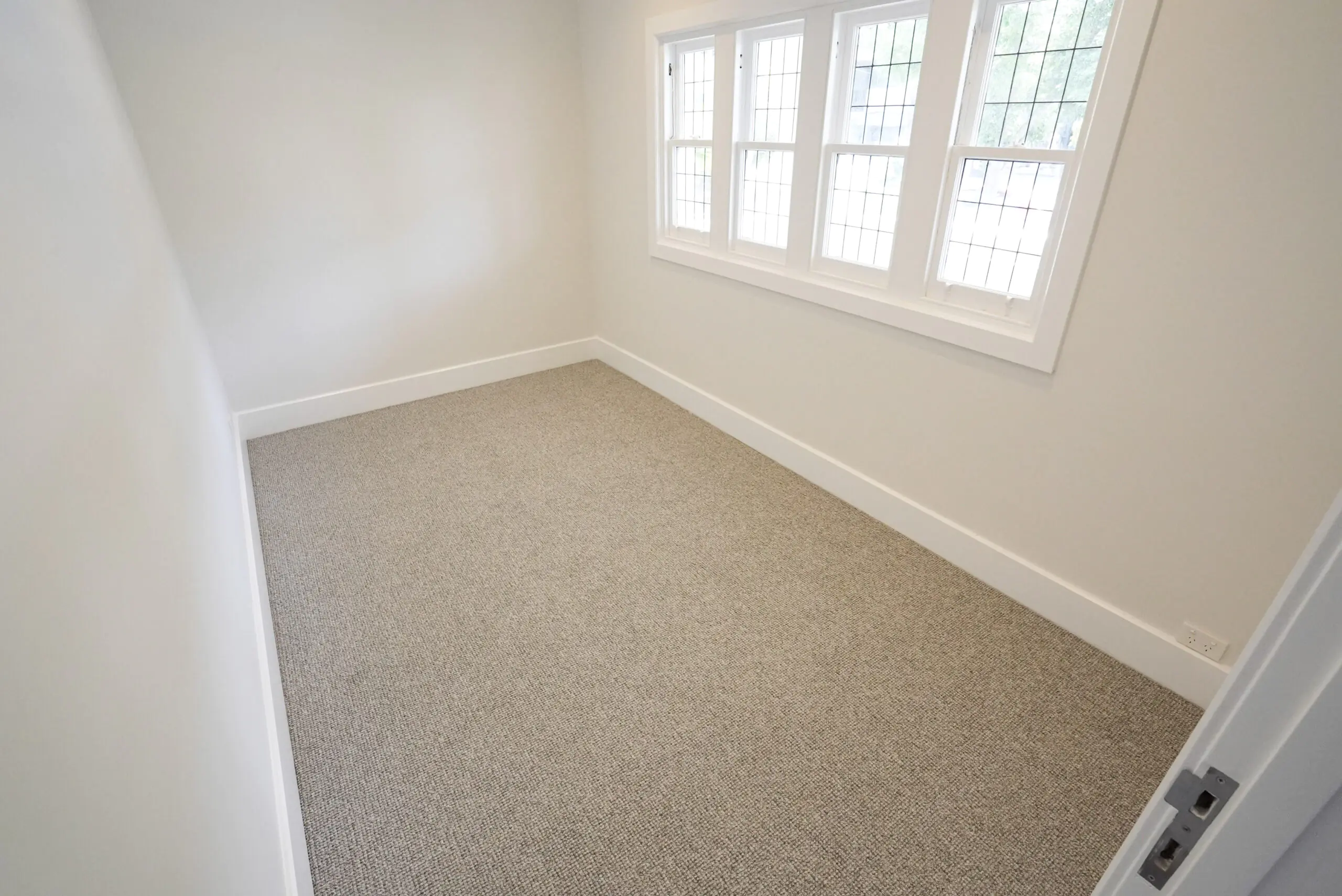 An image of beautiful bedroom in Australia after the carpet installation by Jim's Flooring.