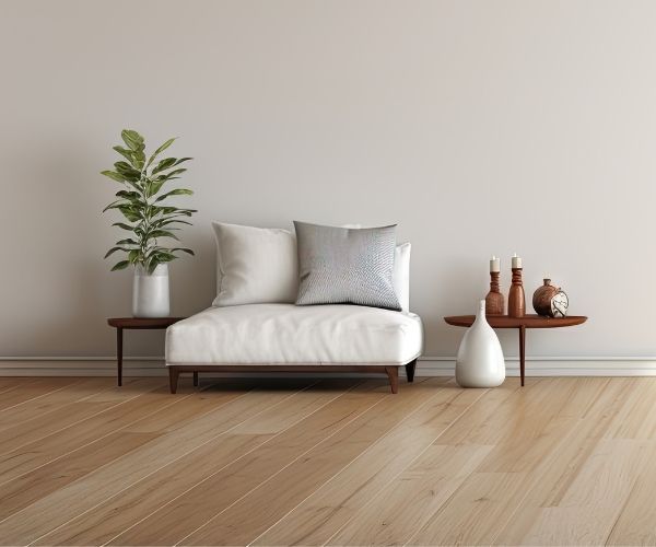 Stylish Melbourne living room with light laminate flooring, a white sofa, and minimalist décor.