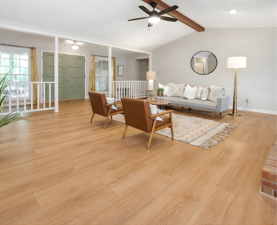 Bright and spacious living area featuring professionally installed flooring with natural oak finish by Jim’s Flooring.